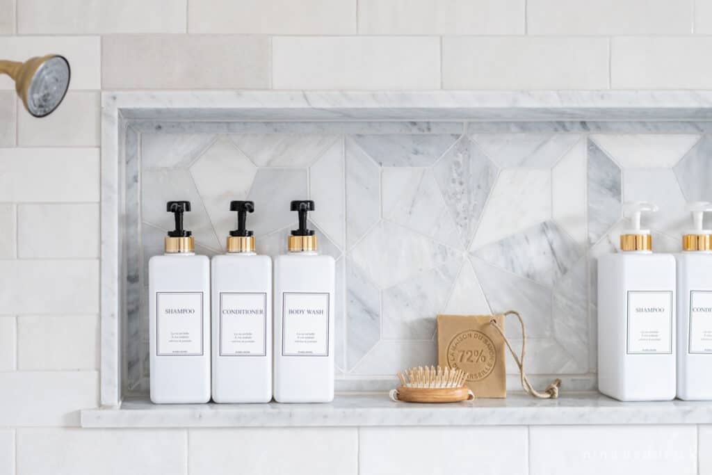 Bathroom shower niche with decanted soap storage idea 
