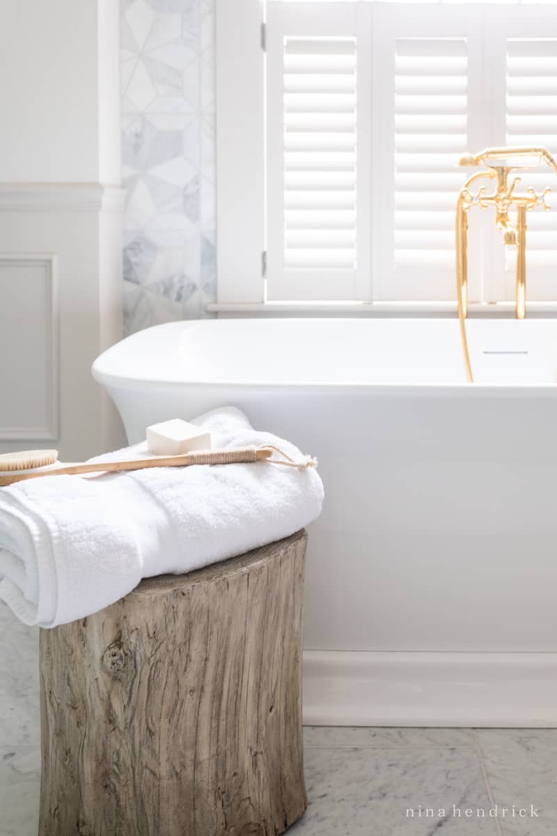 Spa-like bathroom with stump stool and soaking tub