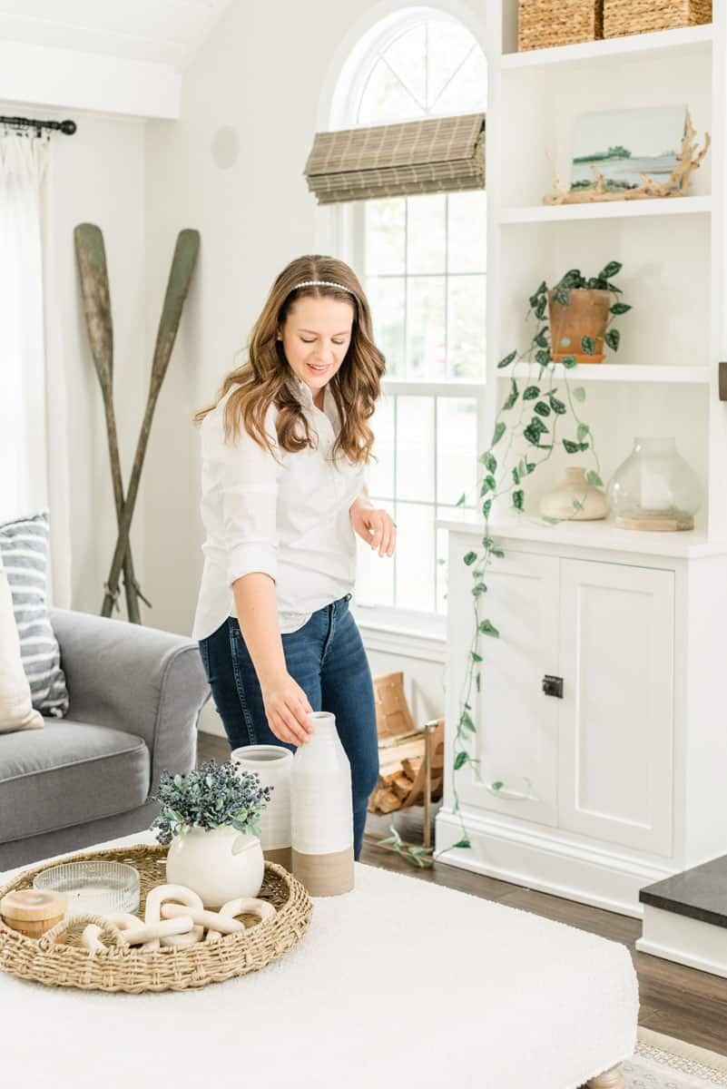 Nina Hendrick styling a bookshelf with vases 