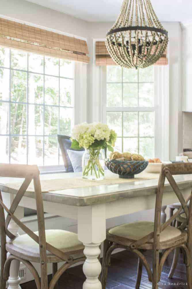 Breakfast nook dining table with chairs and centerpiece