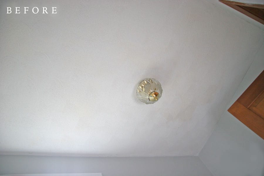 Before photo of a dingy textured ceiling
