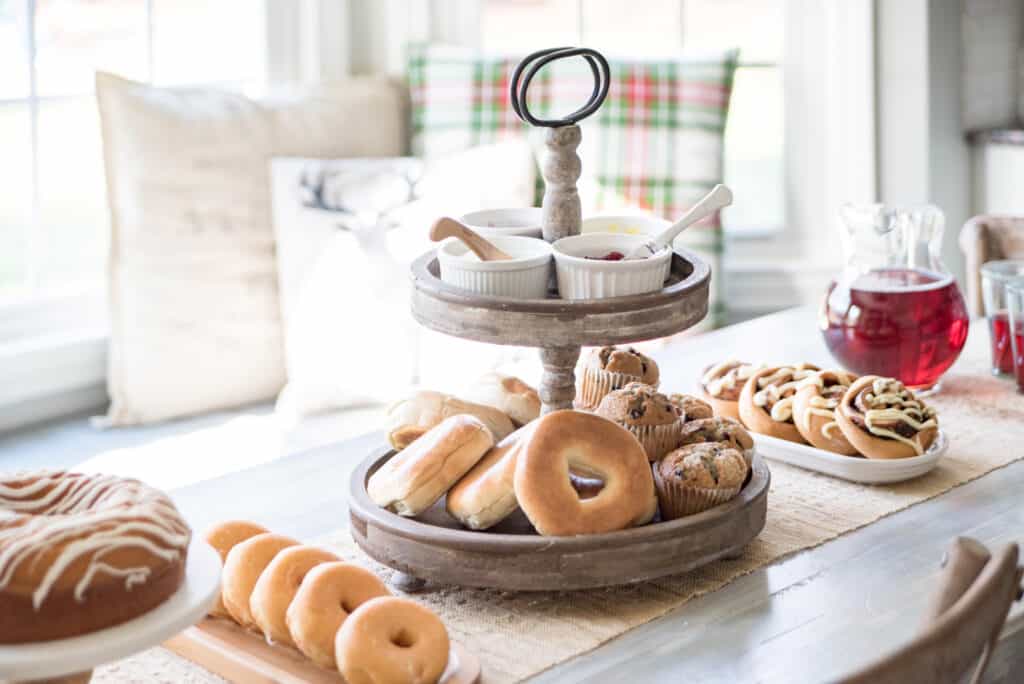 Christmas Brunch ideas for a buffet-style spread, including bages, muffins, donuts, and cinnamon rolls