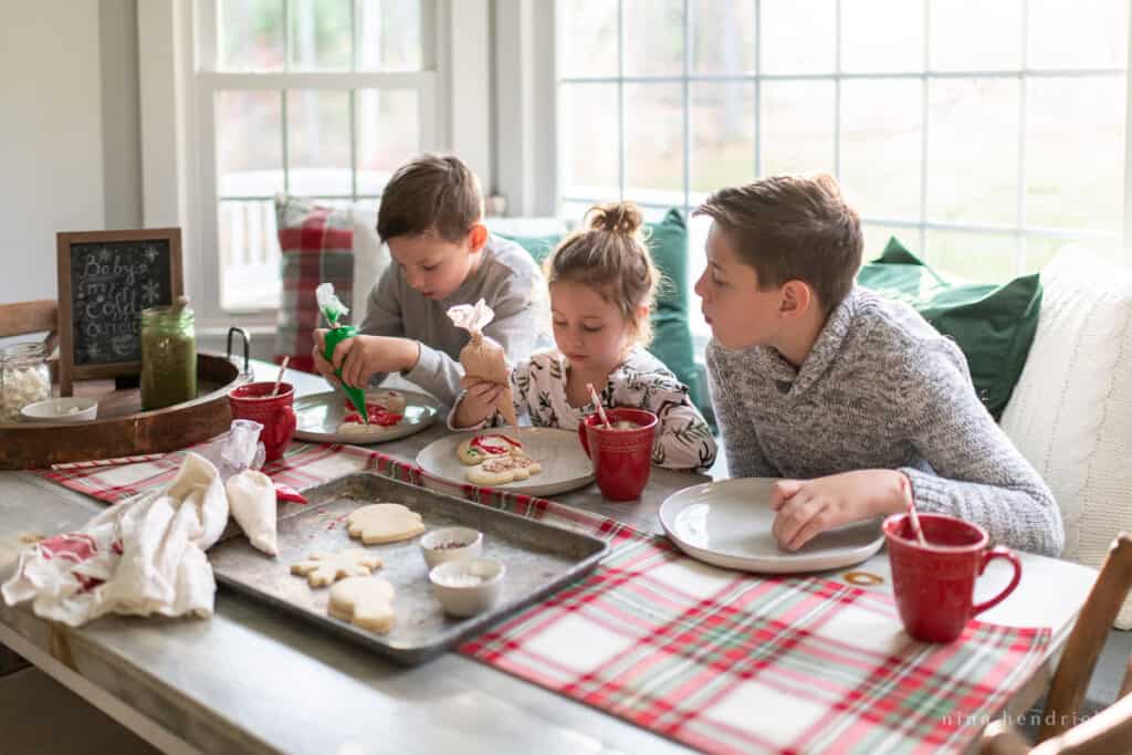 Children decorating Christmas Cookies