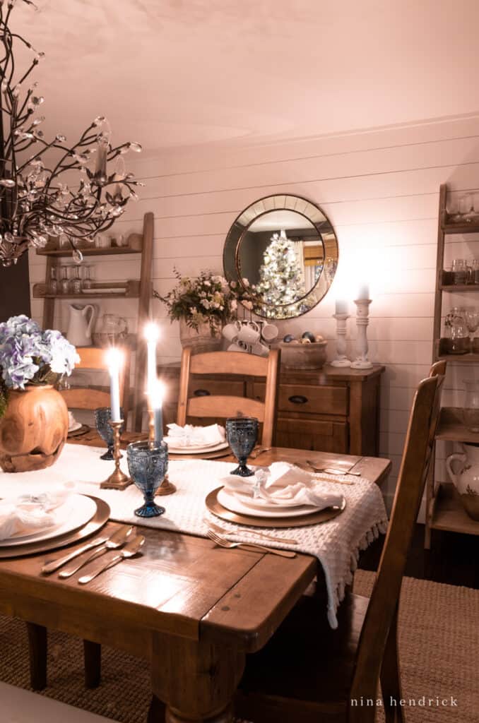 Tablescape home tour at night with buffet and Christmas tree lights in mirror