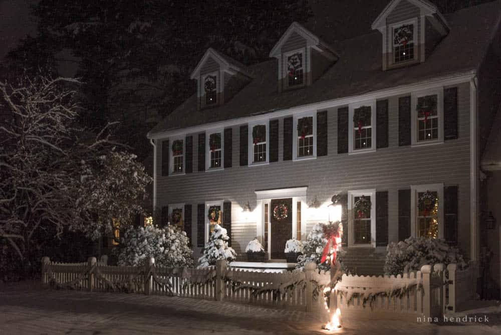 New England Colonial Christmas lights at night