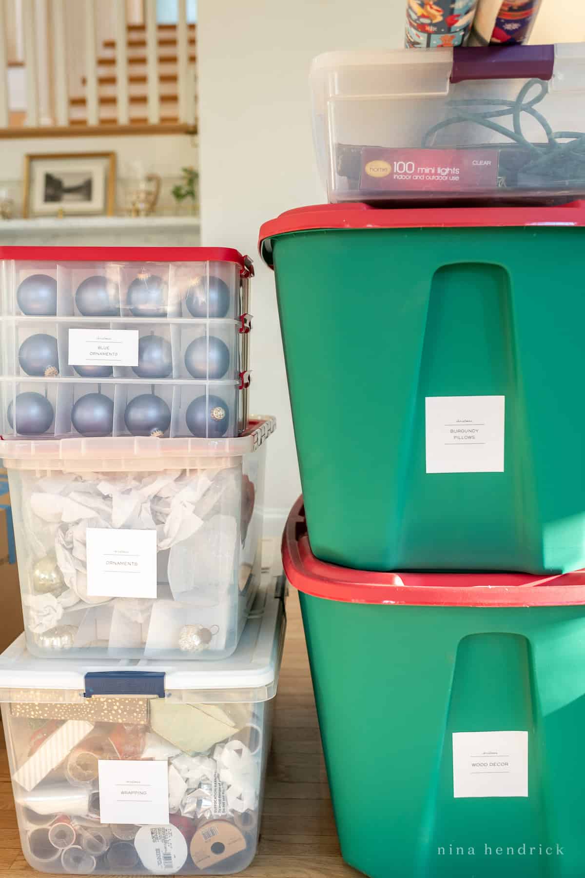 Christmas storage totes and bins stacked with labels