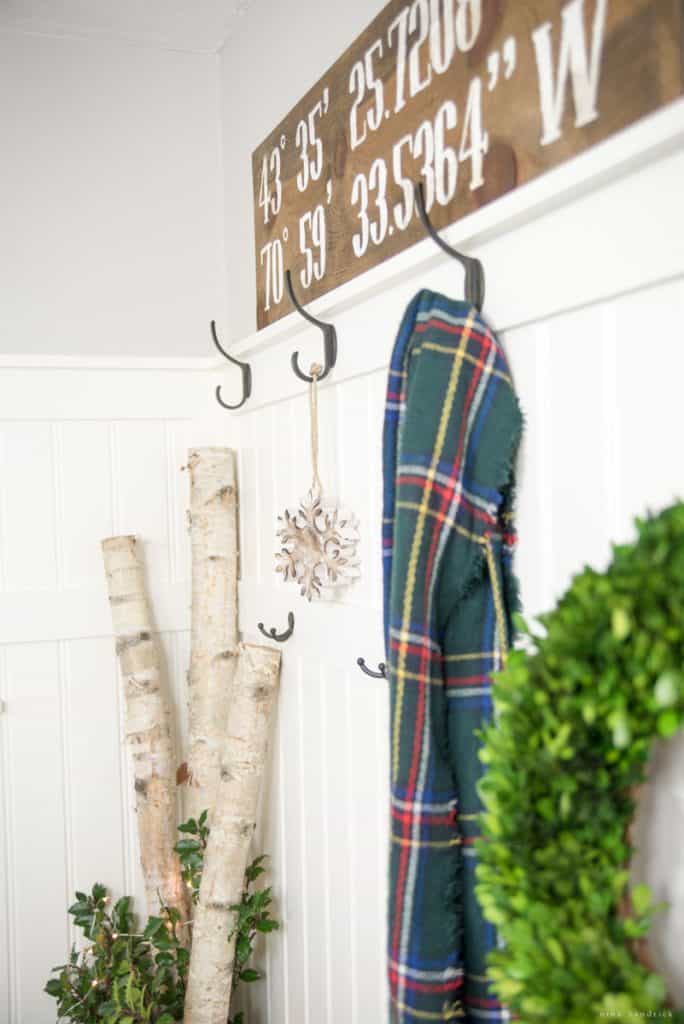 Christmas Mudroom decorating ideas with a scarf and birch logs