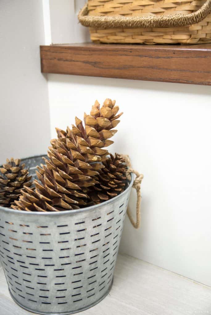 glavanized bucket with giant pinecones Christmas decor