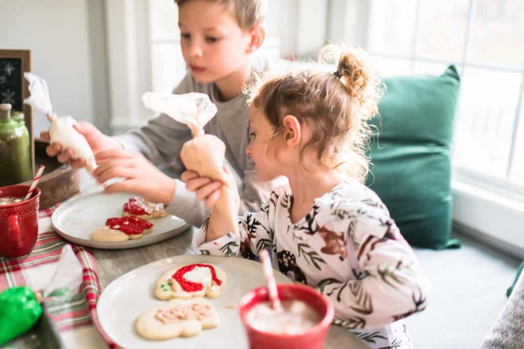 Making Christmas memories by decorating cookies