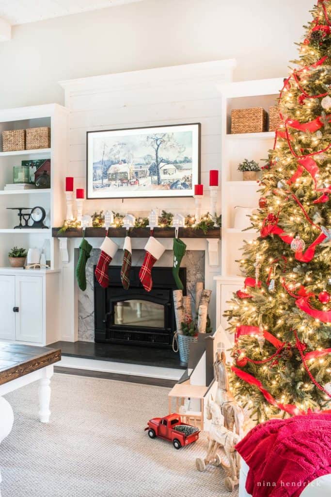 This Classic Christmas Family Room is decorated in traditional red and green with nostalgic and rustic touches to celebrate the season.