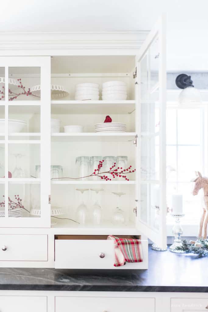 Classic Christmas Kitchen hutch with red and white decor. 