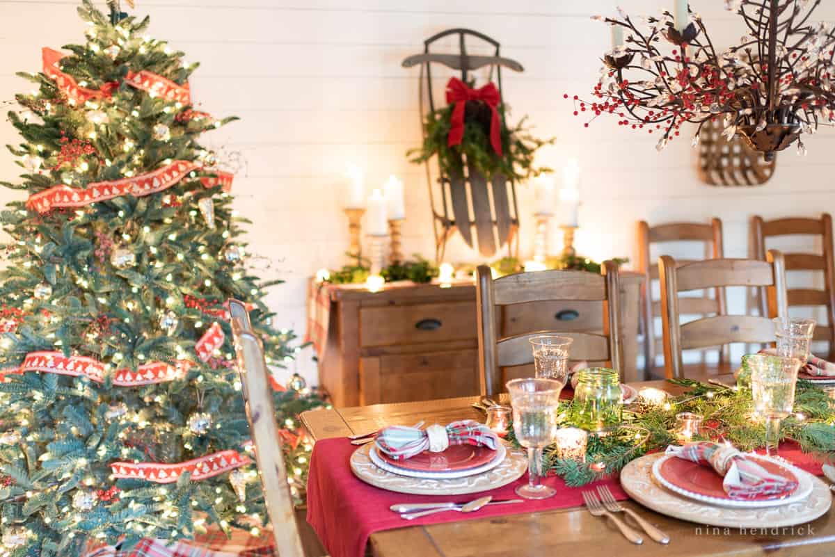 Gather inspiration for your holiday entertaining with this Classic Christmas Tablescape featuring traditional reds and greens. 7 Tips and Tricks for Creating a Festive Christmas Tablescape with red and green elements