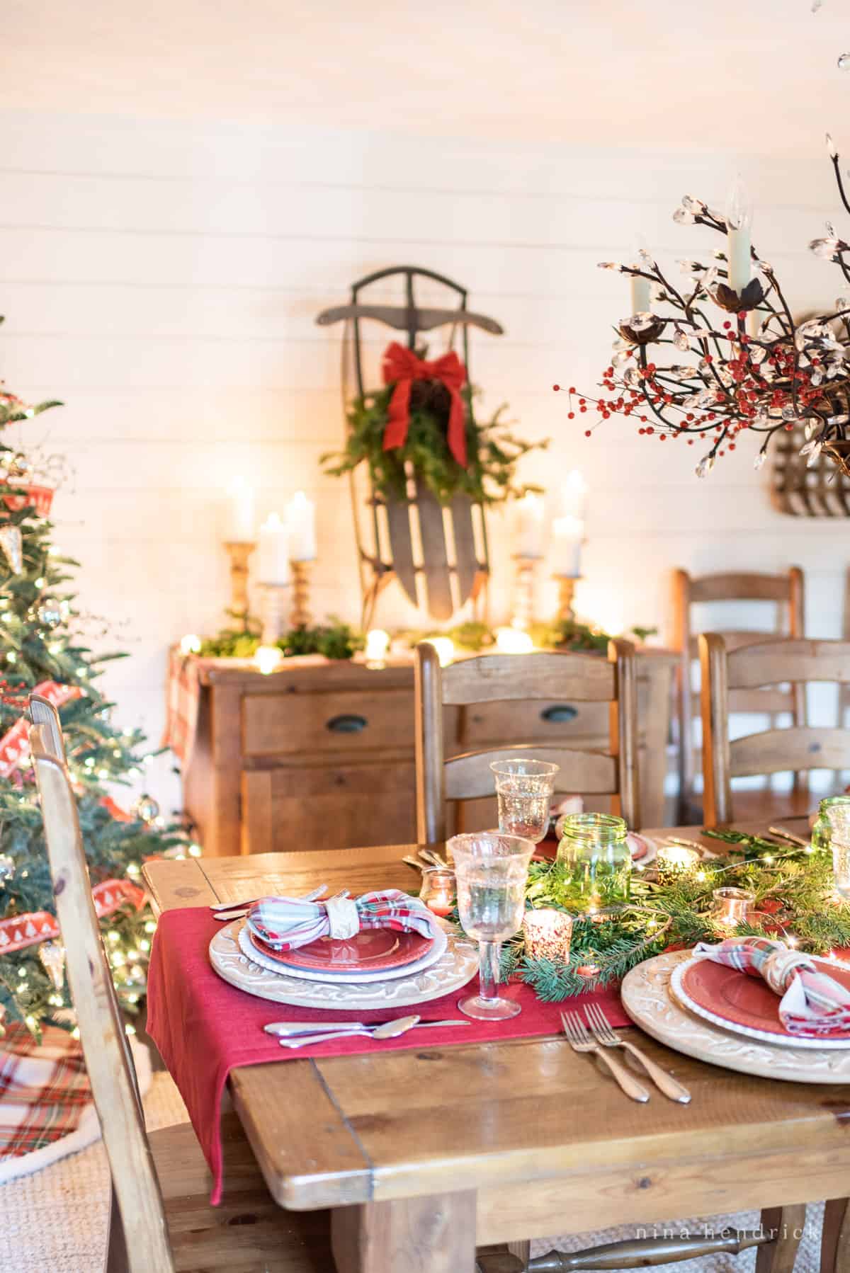 Gather inspiration for your holiday entertaining with this Classic Christmas Tablescape featuring traditional reds and greens. Holiday table setting ideas with red and green accents
