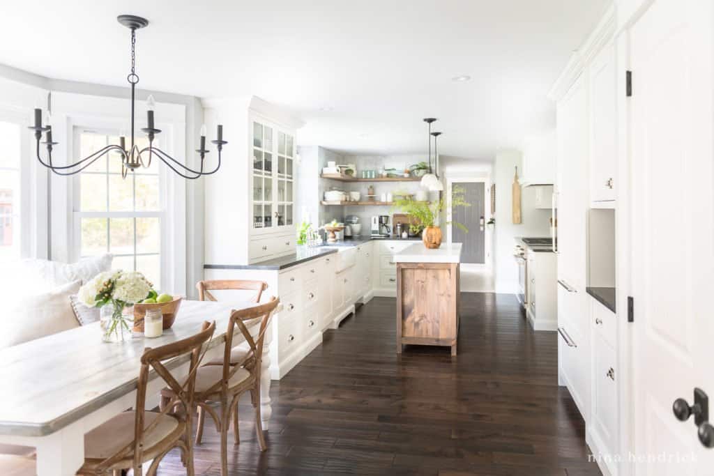 Classic kitchen with white cabinets and dark hardwood floors