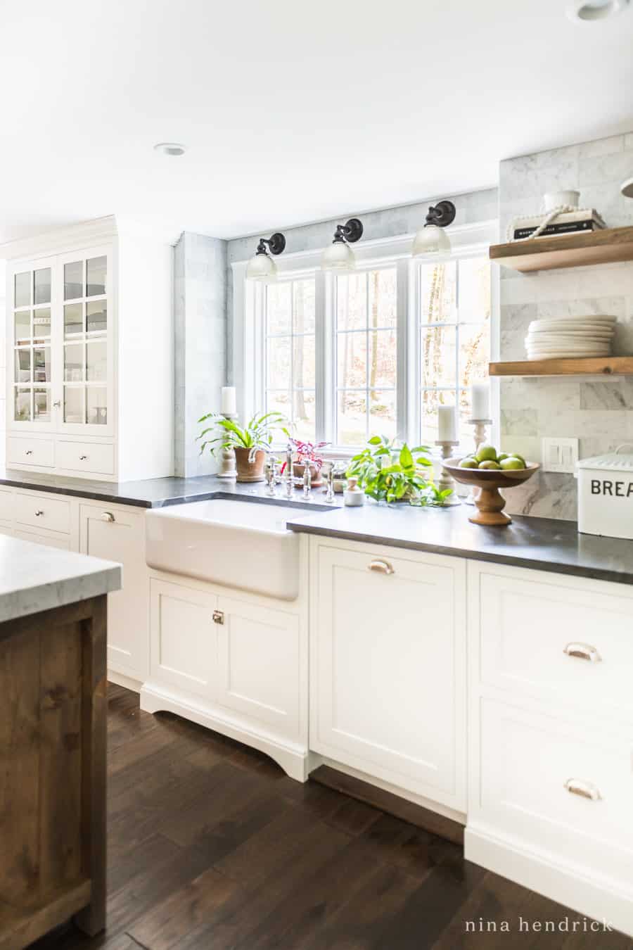 Hidden dishwasher and trash cans in a classic kitchen makeover