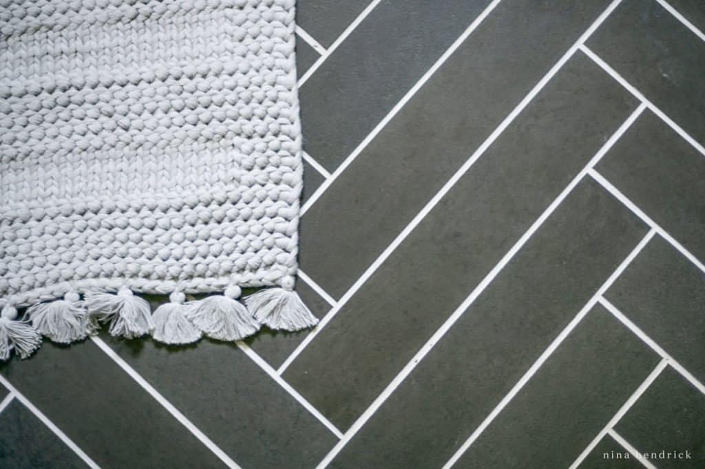herringbone tile floor with slate-look porcelain