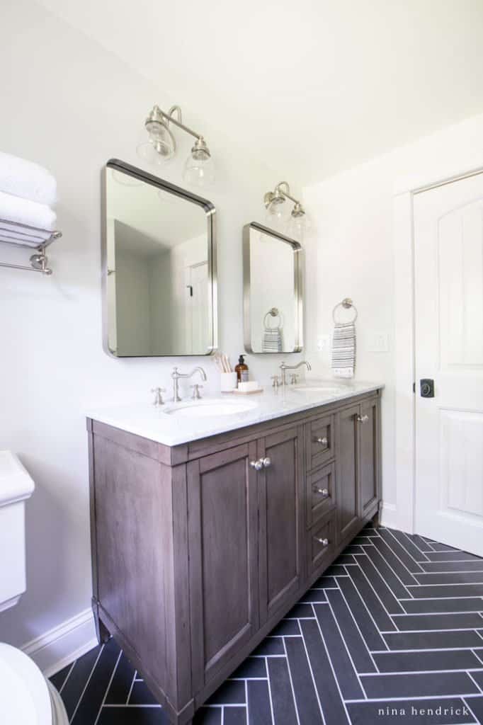 herringbone floor and vanity in a small bathroom makeover