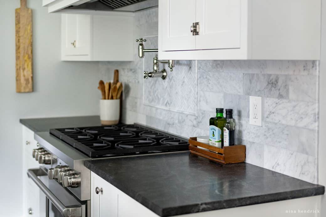 Dark jet mist granite countertop and Wolf range