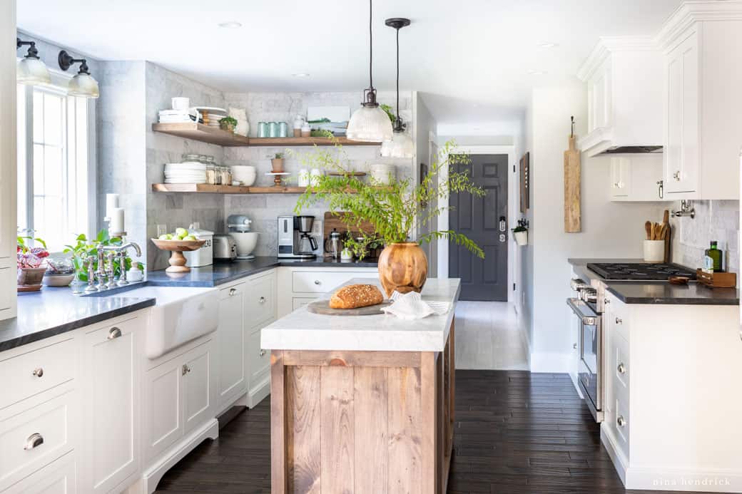 Kitchen makeover with rustic touches like a wood island and shelves