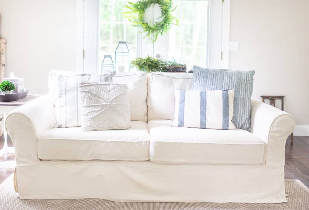 White sofa with clean white slipcovers in a family room