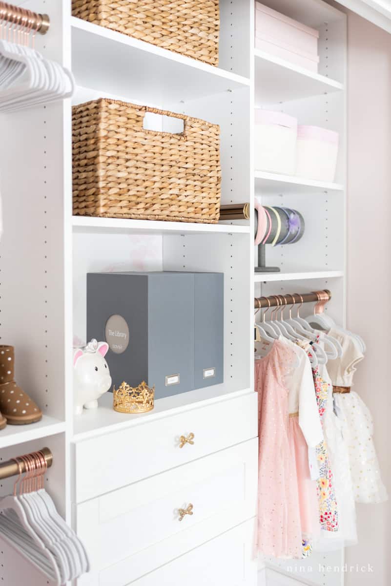 Closet organization ideas for a little girl's closet with space saving hangers and baskets