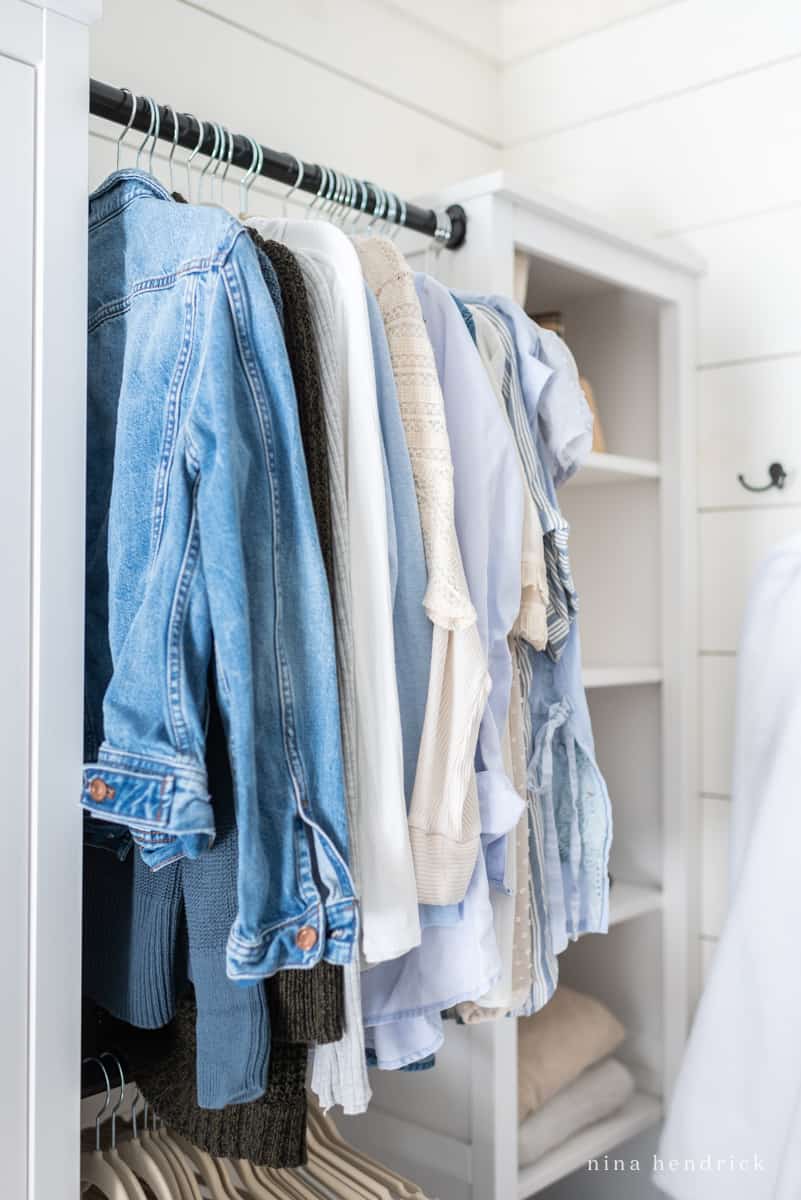 Jackets and shirts hanging in a closet