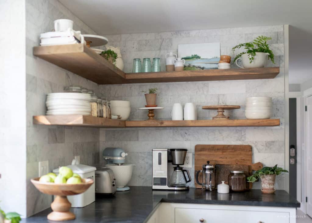 Corner floating shelves with a countertop coffee bar in the kitchen