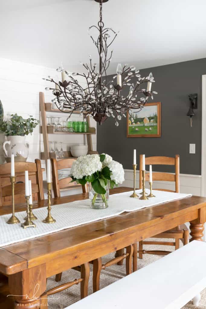 This Collected and Contrasting Dining Room Refresh features a bold wall color, natural textures, and strategies for decorative storage. 