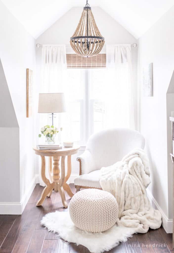 A reading nook with blankets for cozy winter home inspiration 