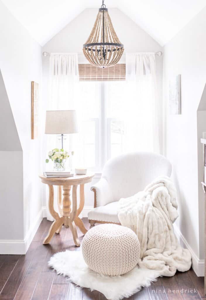 A reading nook with blankets for cozy winter home inspiration