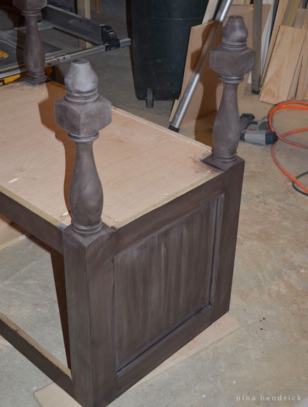 Applying dark weathered stain to a DIY bathroom vanity