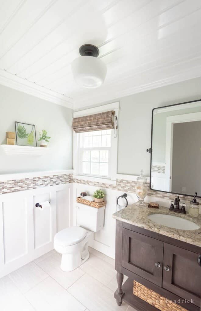 Light powder room with board-and-batten and beadboard ceiling