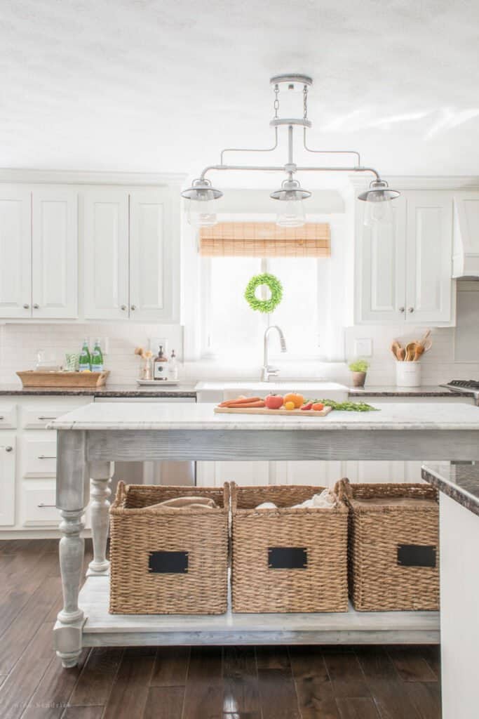 DIY kitchen island with baskets in a white kitchen