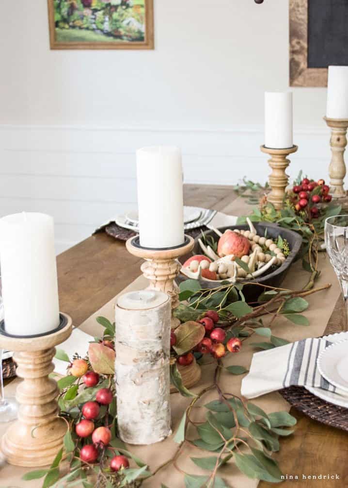 Tablescape with seeded eucalyptus and apples