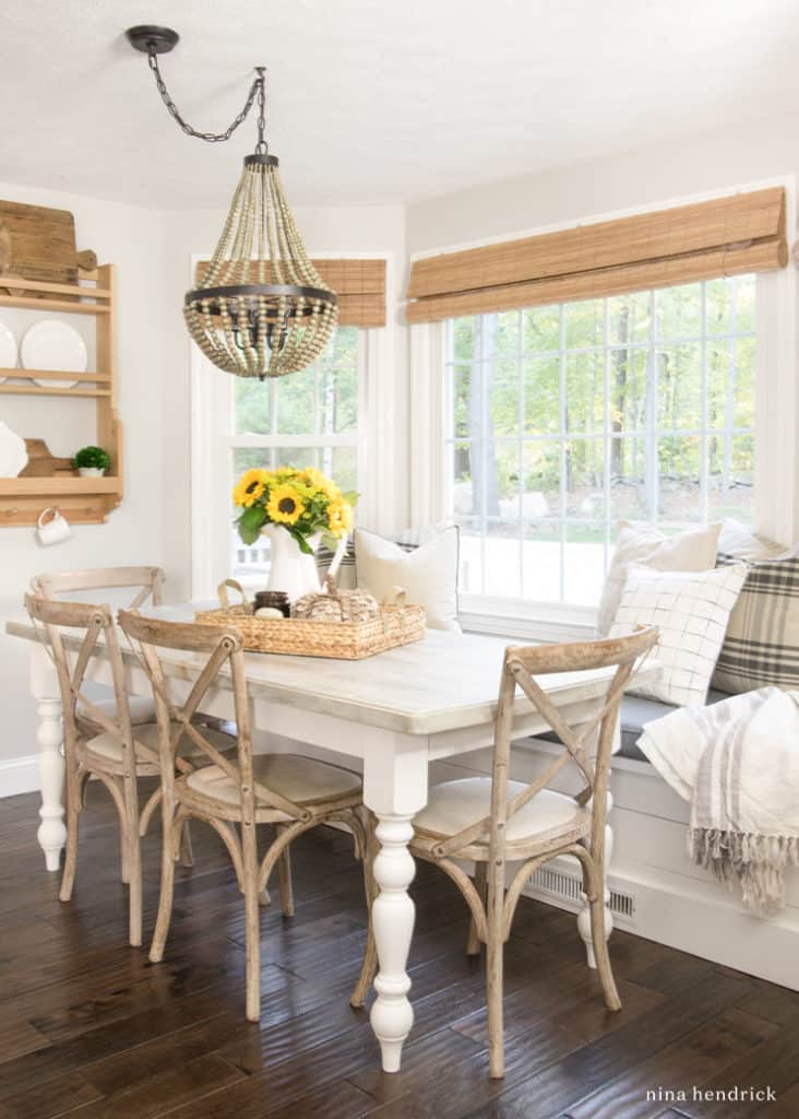 Breakfast nook with sunflowers and plaid pillows