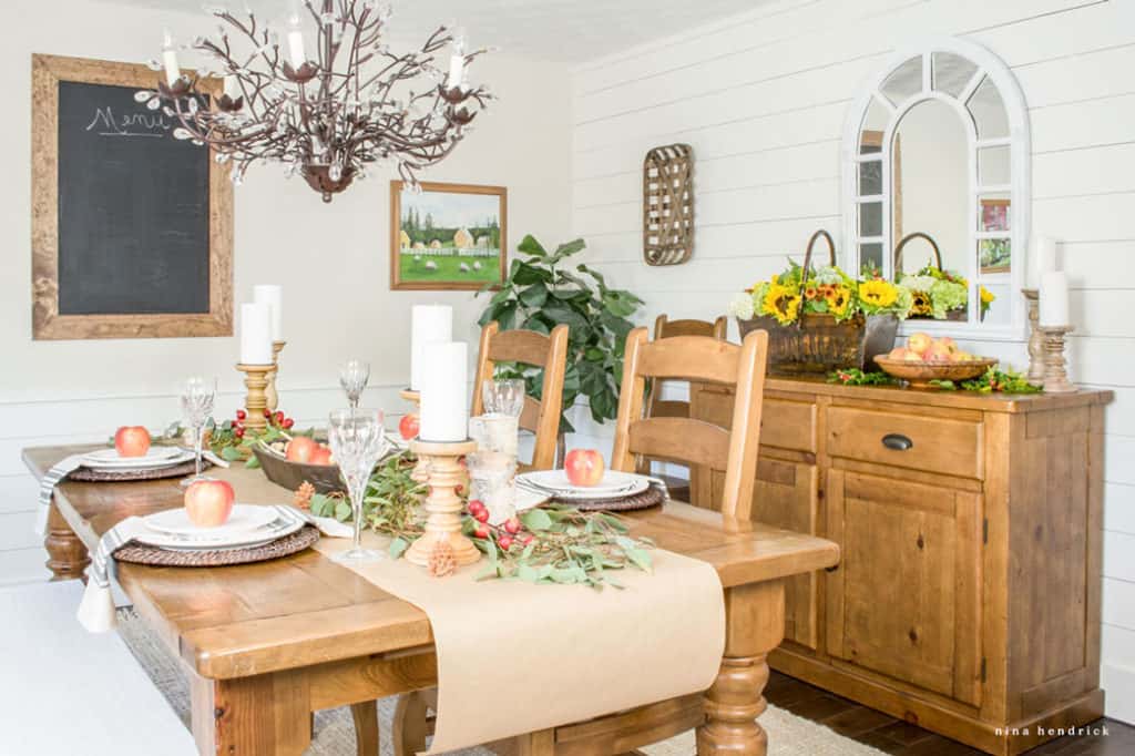 Dining room decorated for early fall with wood table