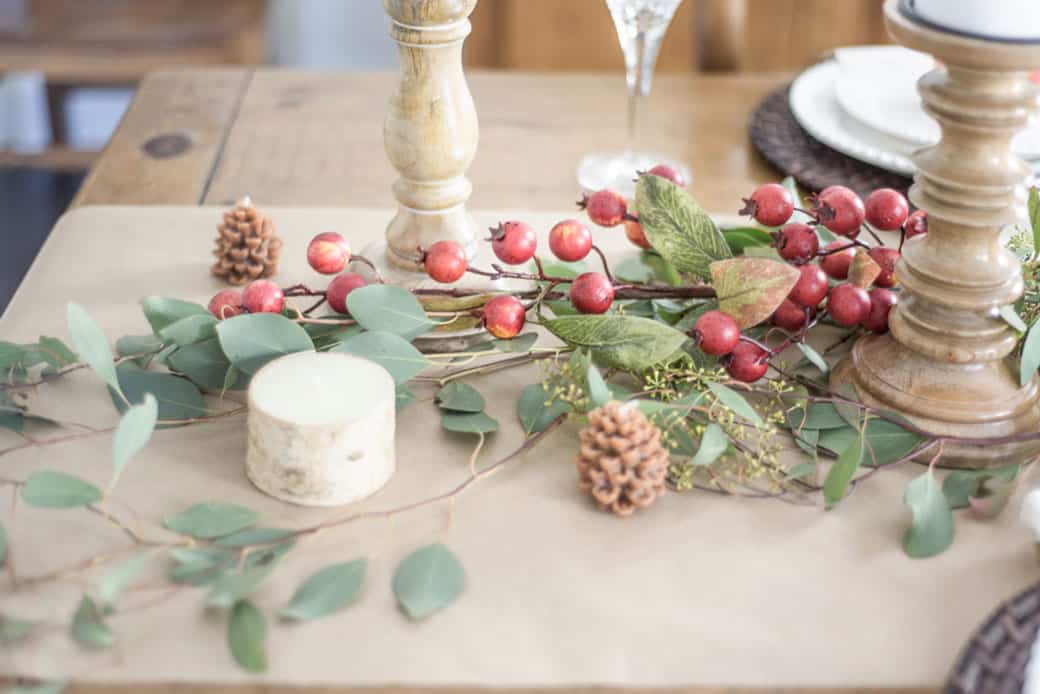 Candles and eucalyptus on a paper runner