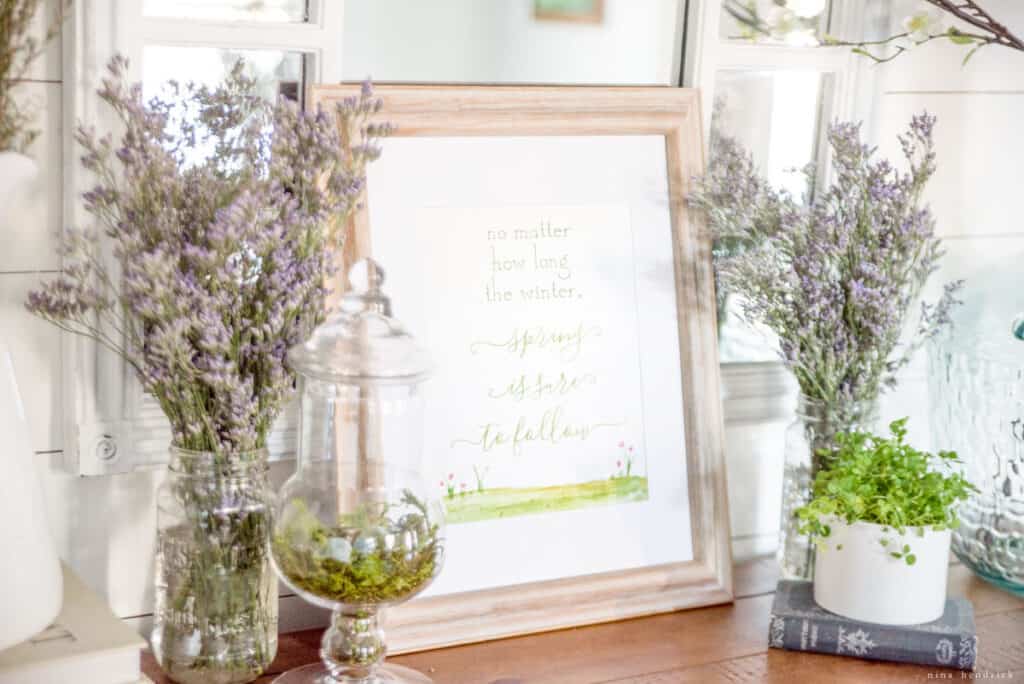 Spring is sure to follow print in vignette with flowers and greenery