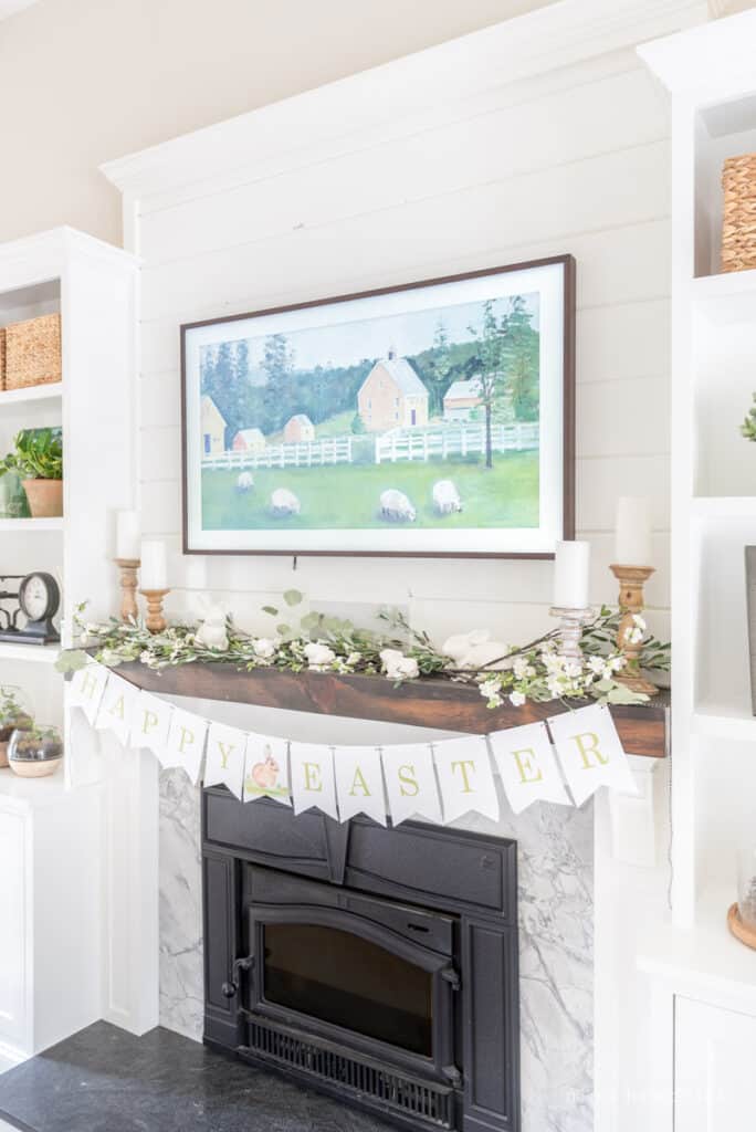 Fireplace with "Happy Easter" printable banner and bunny statues