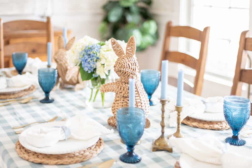 Wicker bunnies on a blue spring tablescape