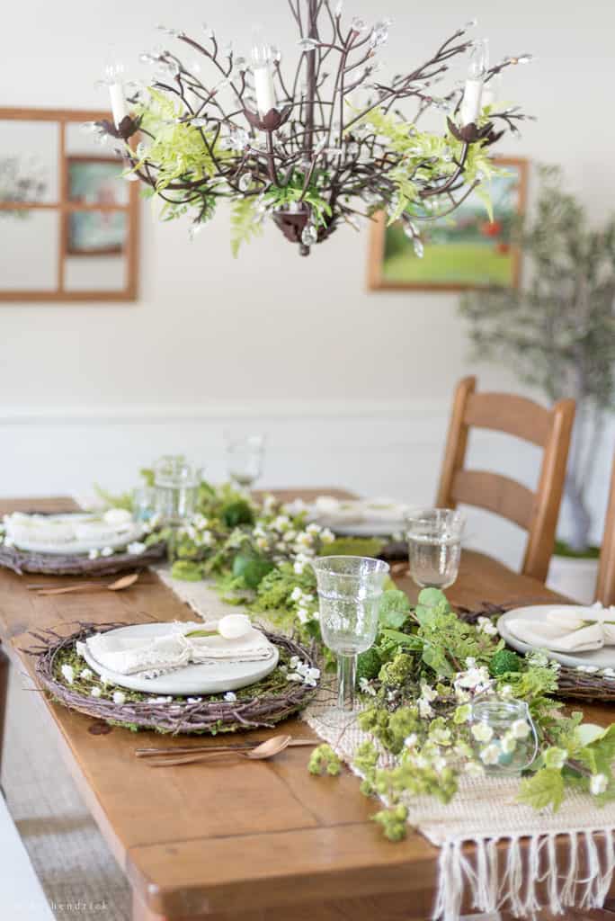Nature-inspired spring centerpiece with moss eggs.