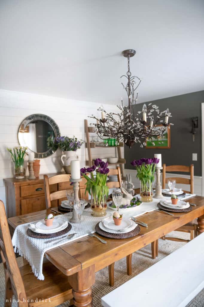 Easter tablescape with purple flowers. 