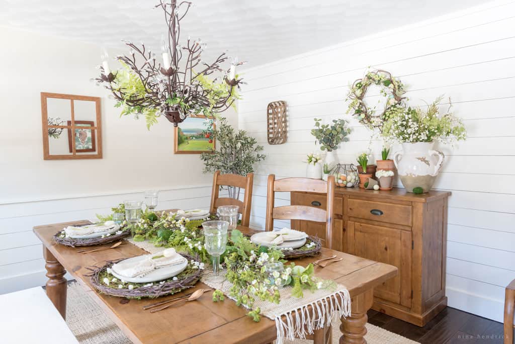 Natual spring tablescape with green and orange accents.