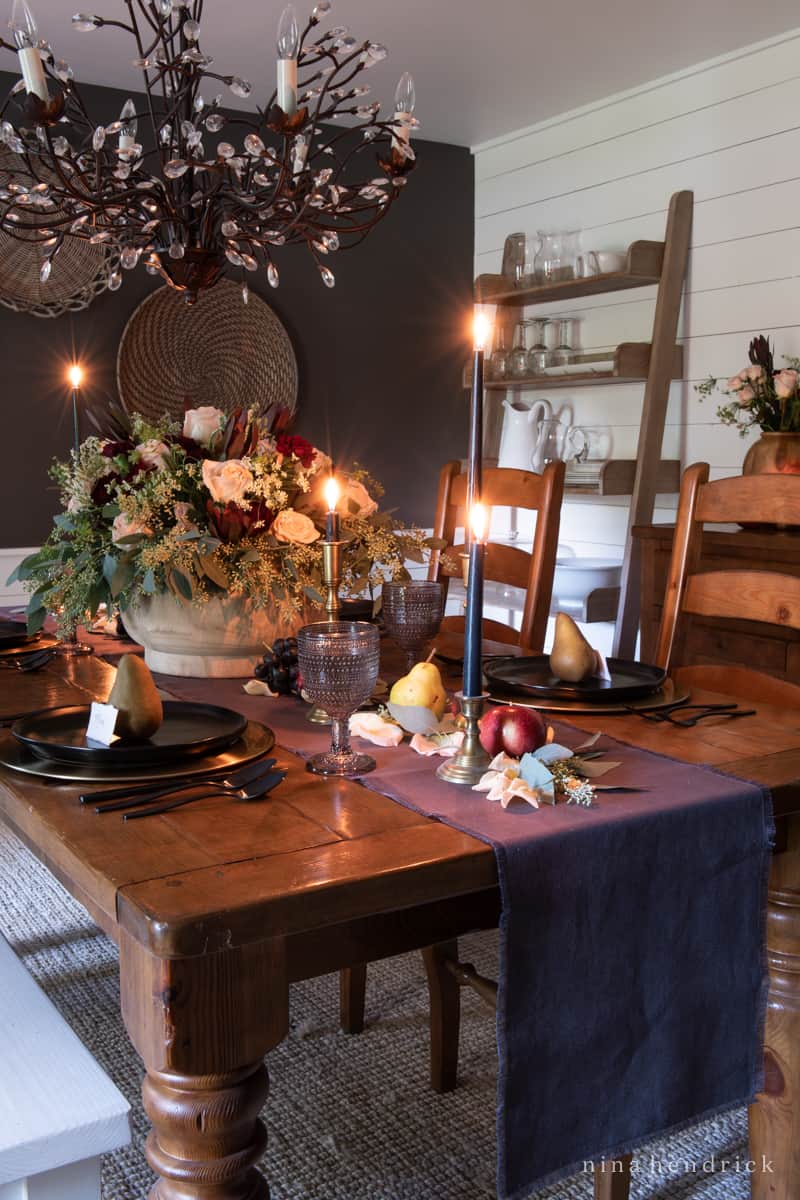An elegant dining room table with a fall tablescape.