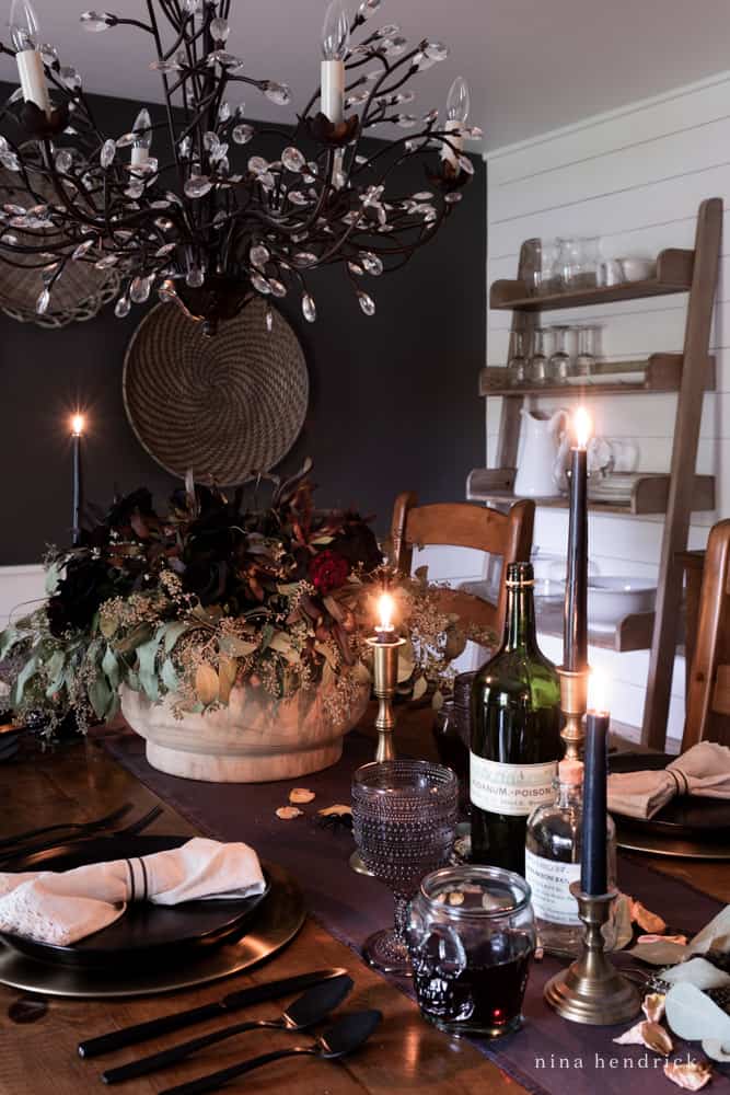 Elegant Halloween Tablescape with skull wine goblets and dark accessories