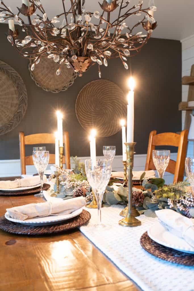 Candlelit winter tablescape with Kendall Charcoal walls and chandelier