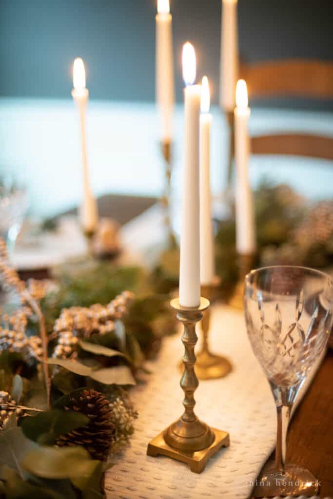 table centerpiece with brass candlestick and Waterford crystal glass