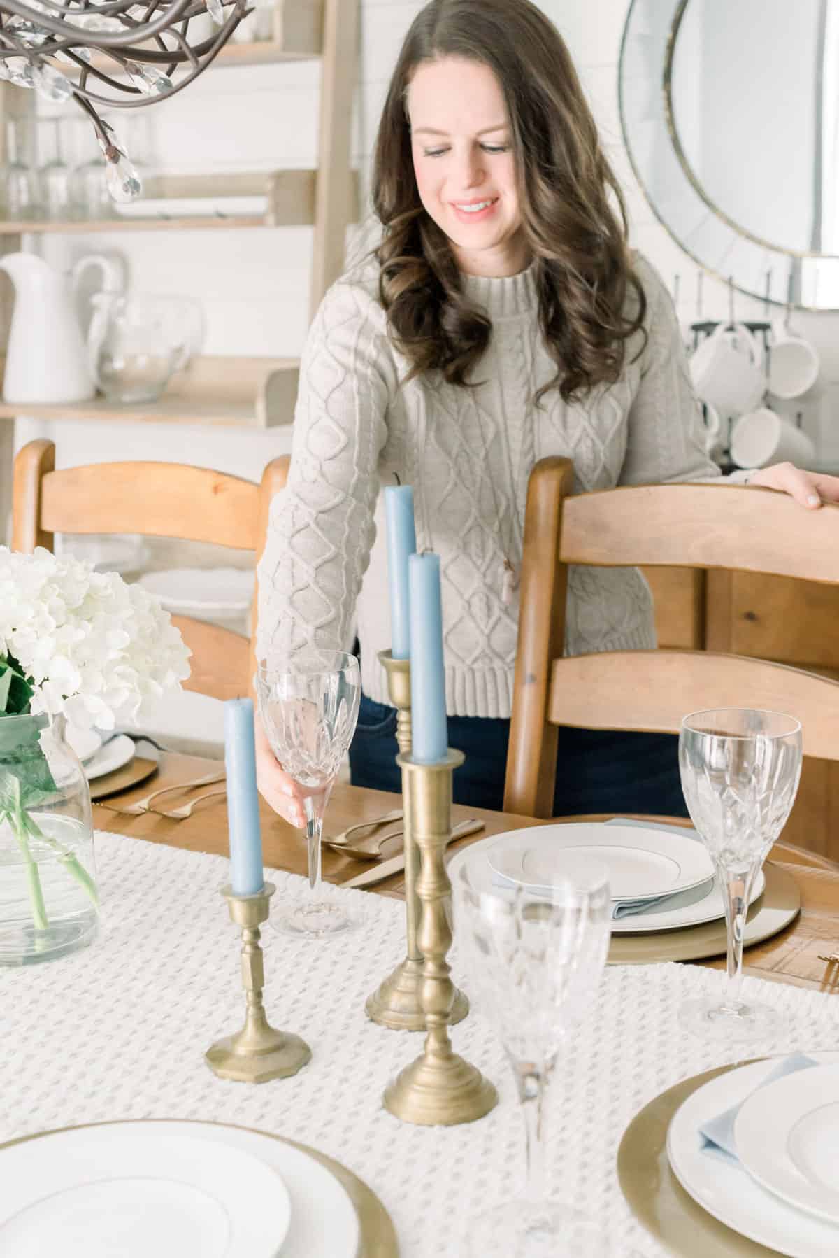 Nina Hendrick entertaining essentials — placing a crystal glass on a table setting