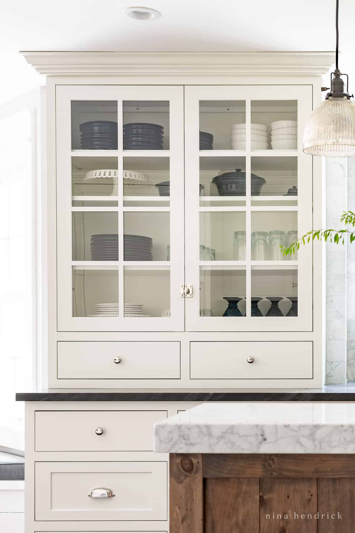 China cabinet filled with blue and white serving pieces