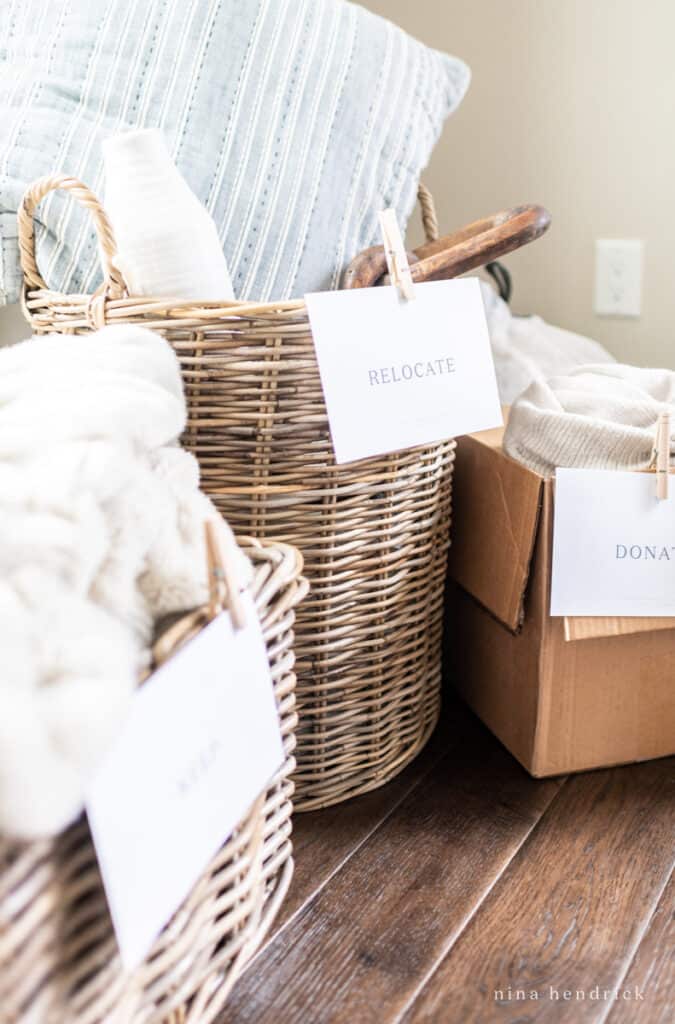 how to declutter your home with signs for categorizing items into boxes and baskets 